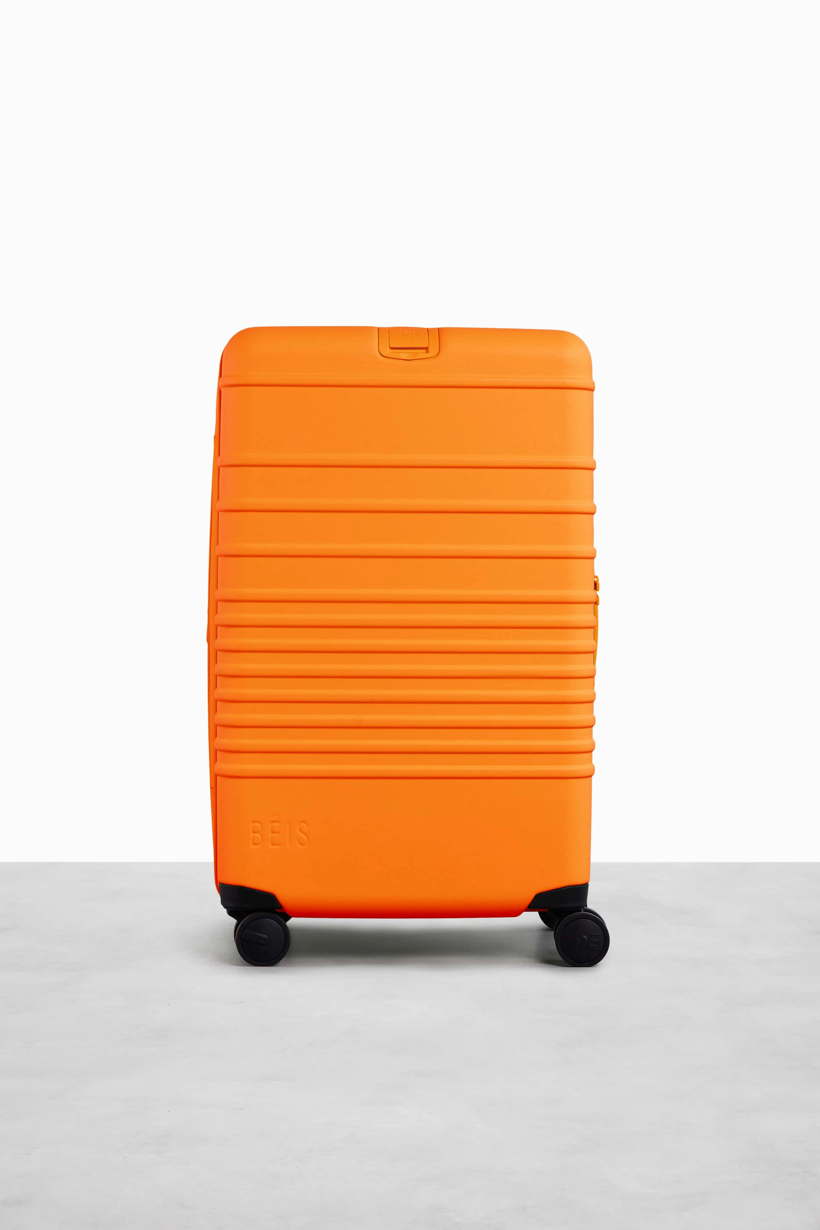 The Medium Check-In Roller in Creamsicle