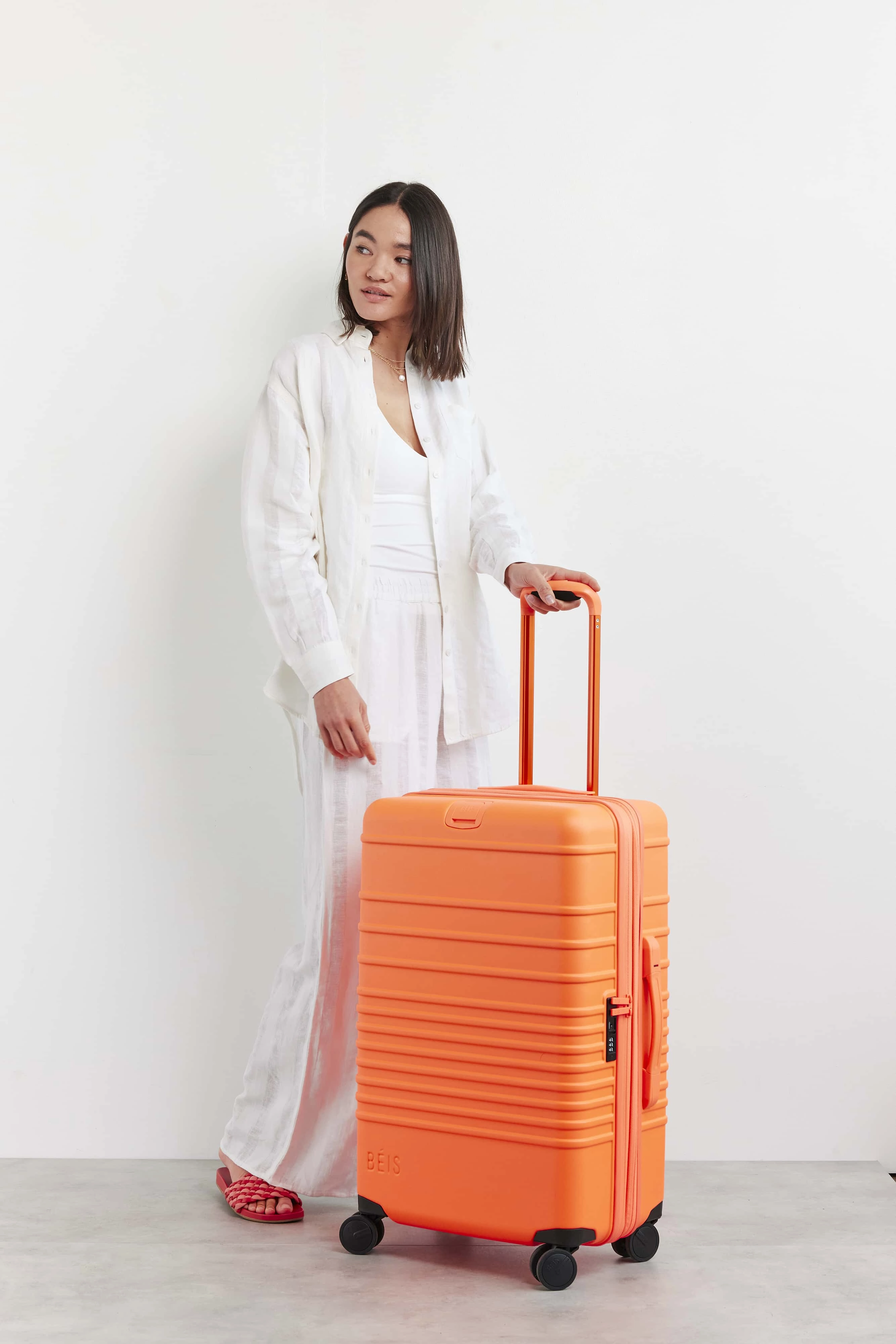 The Medium Check-In Roller in Creamsicle